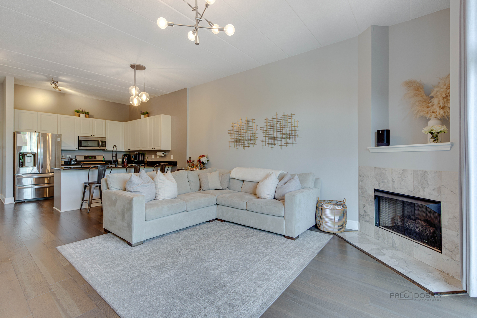 1301 West Washington Boulevard, Unit 309 Chicago, IL 60607 - Photo 12 of 23 a living room with furniture and a fireplace