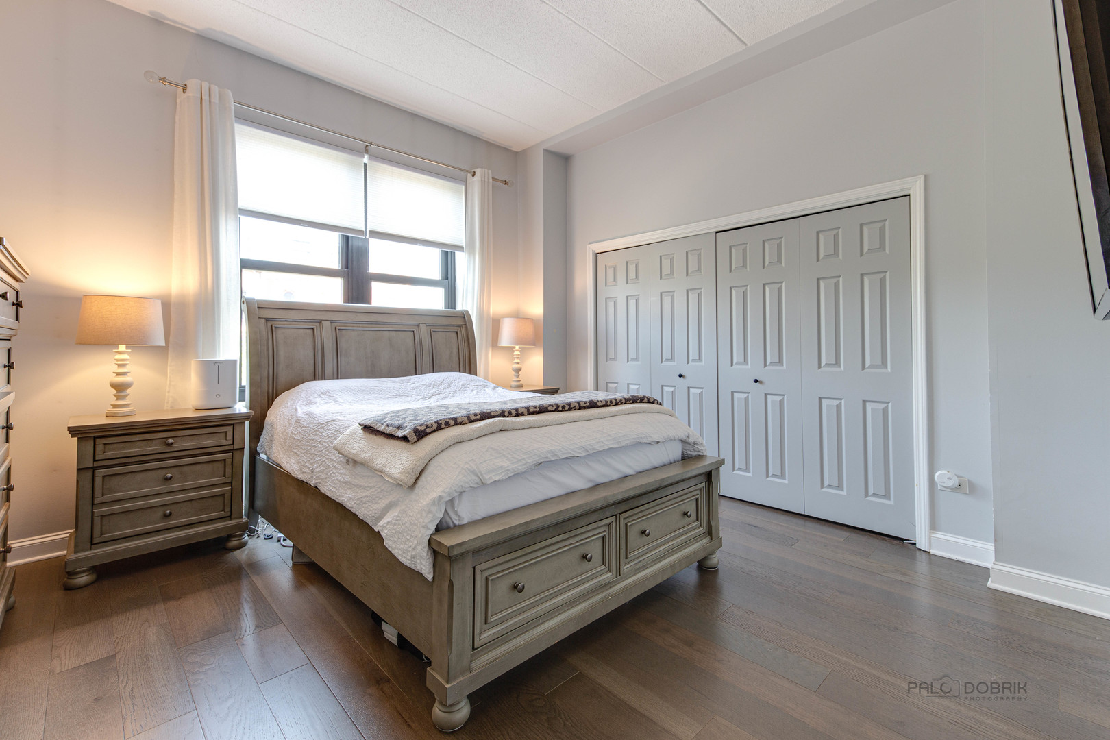 1301 West Washington Boulevard, Unit 309 Chicago, IL 60607 - Photo 16 of 23 a bedroom with a bed and a window