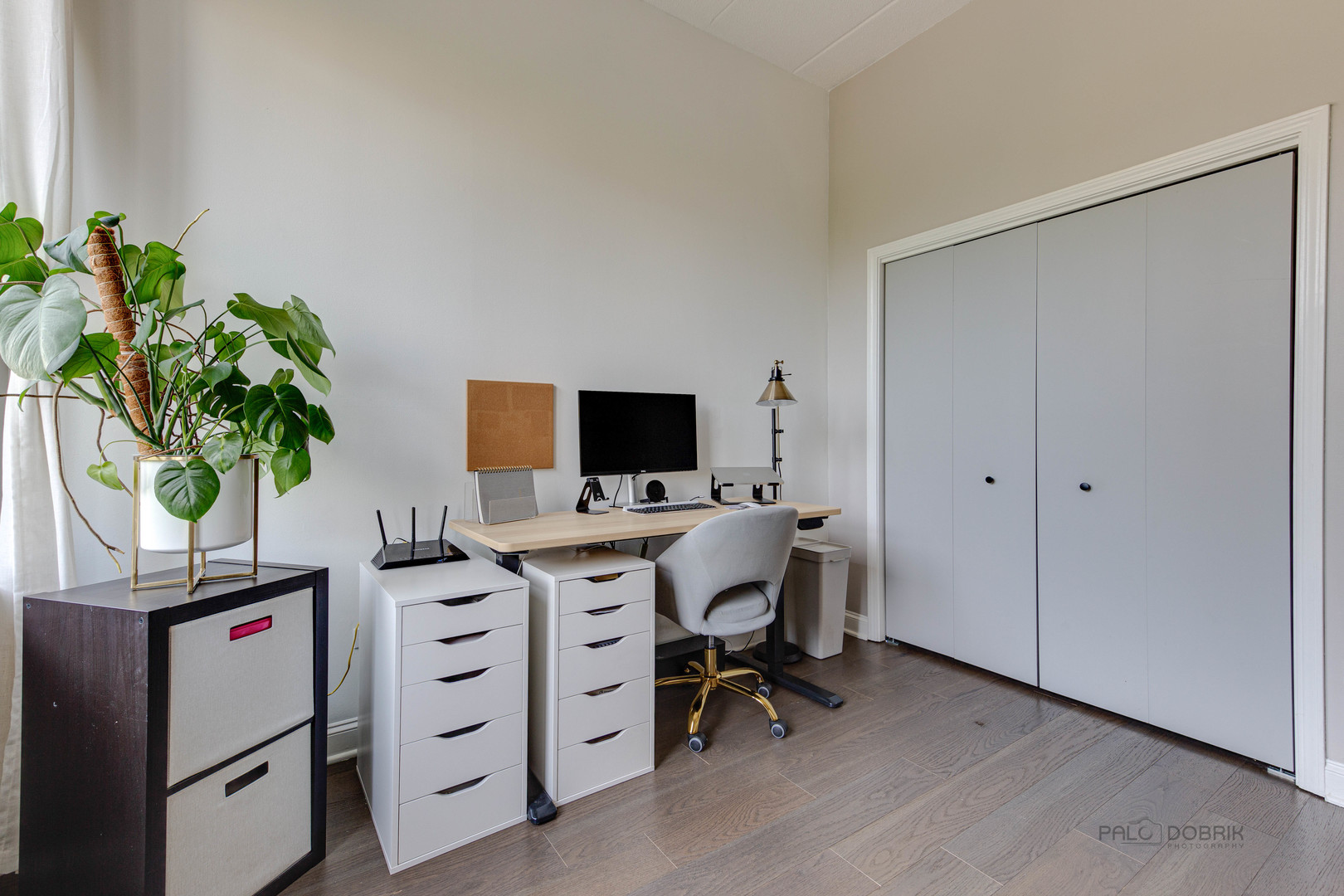 1301 West Washington Boulevard, Unit 309 Chicago, IL 60607 - Photo 20 of 23 a view of a workspace with furniture and a potted plant