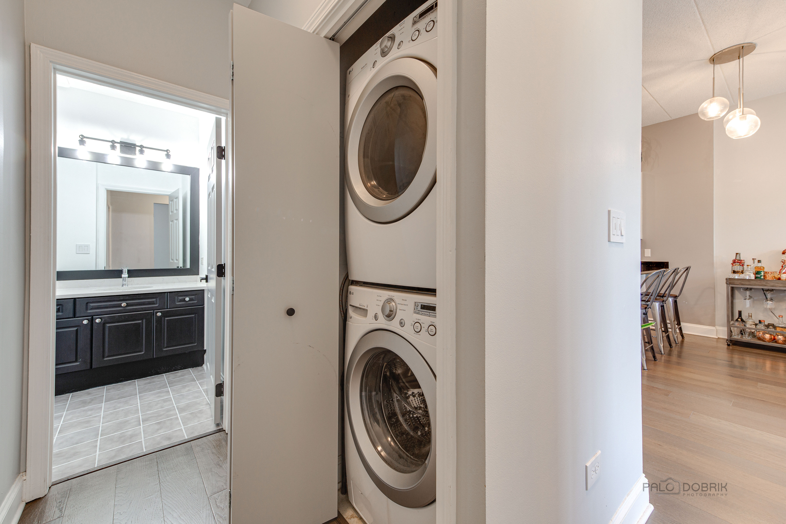 1301 West Washington Boulevard, Unit 309 Chicago, IL 60607 - Photo 21 of 23 a view of a kitchen with washer and dryer