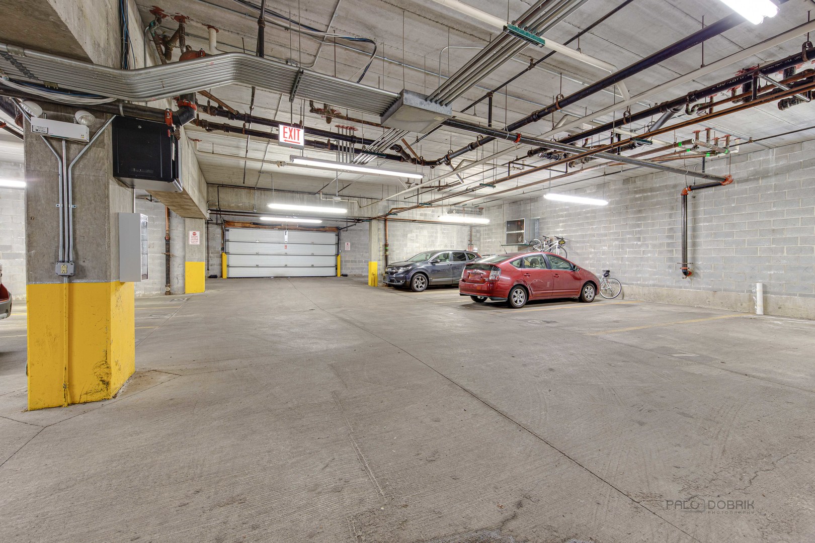 1301 West Washington Boulevard, Unit 309 Chicago, IL 60607 - Photo 23 of 23 a view of parking garage with cars