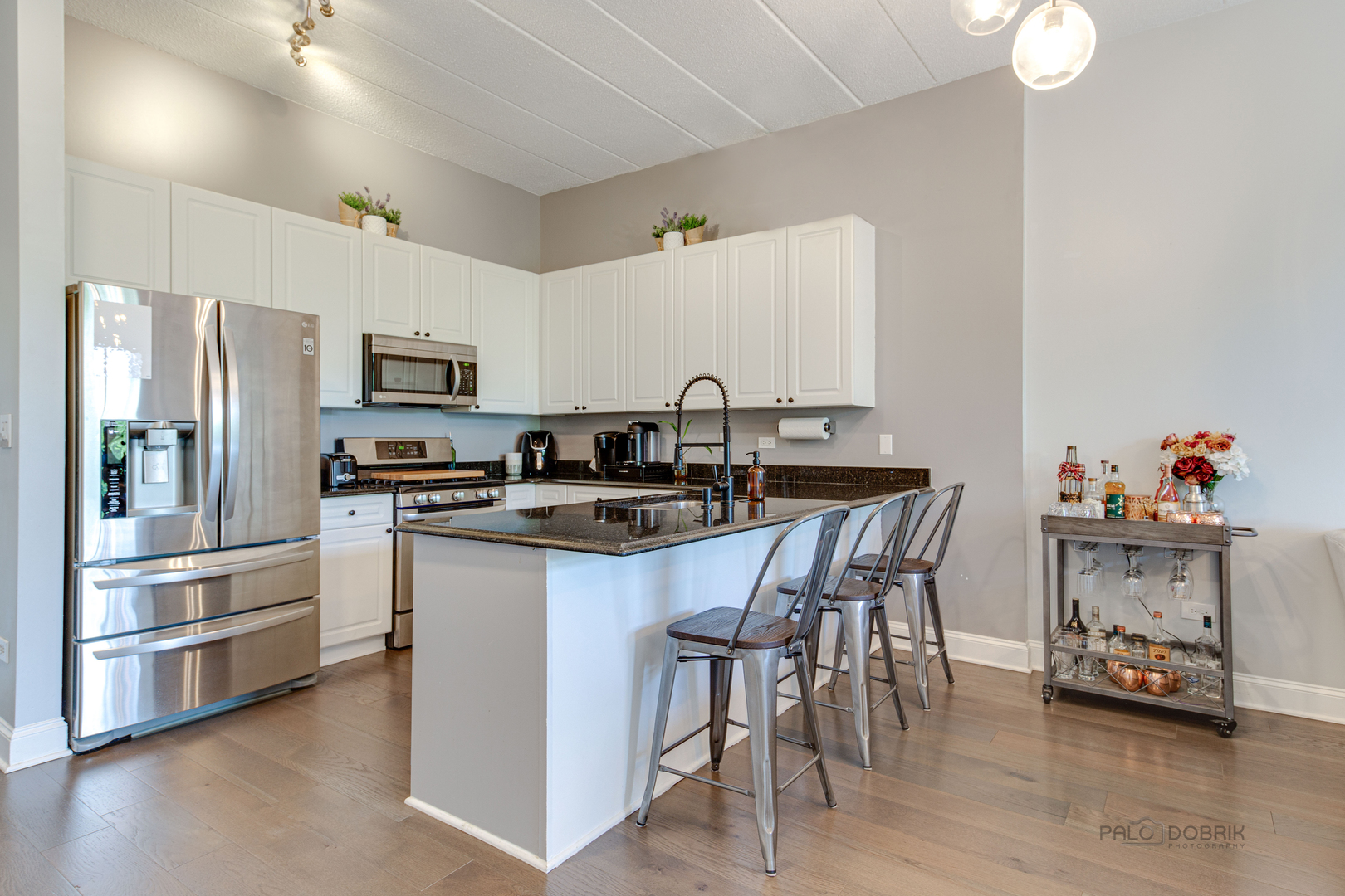 1301 West Washington Boulevard, Unit 309 Chicago, IL 60607 - Photo 5 of 23 a kitchen with granite countertop a sink appliances and cabinets