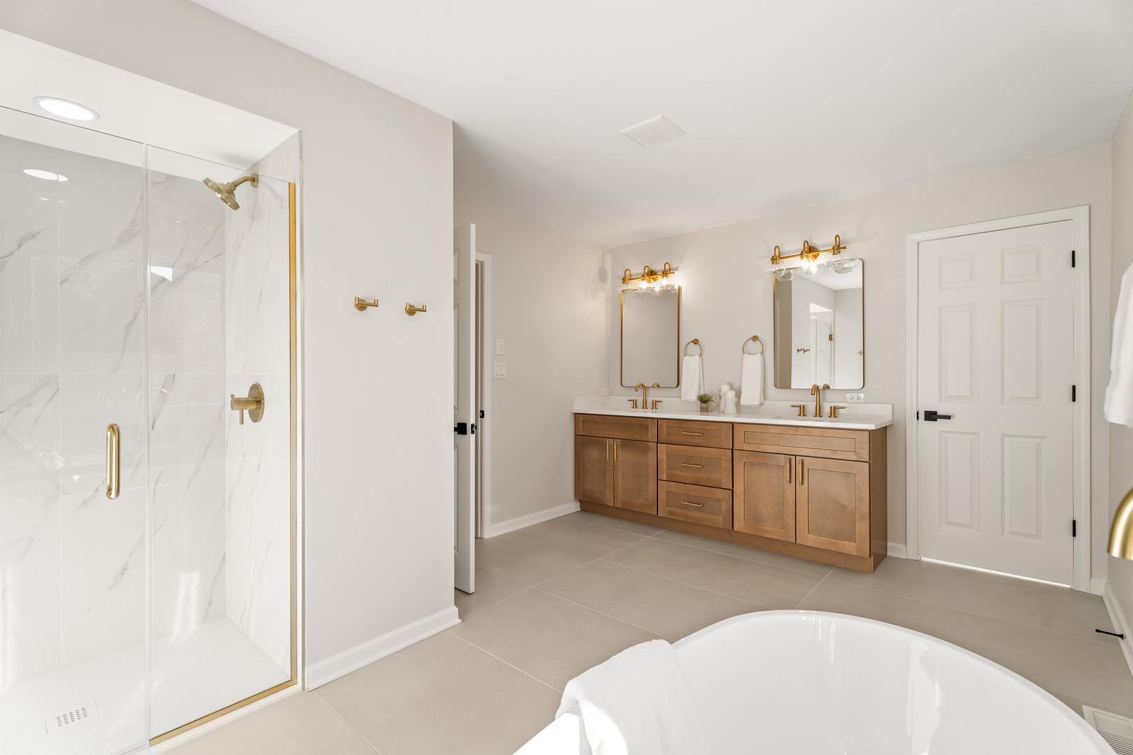 2817 Modaff Road Naperville, IL 60565 - Photo 19 of 43 a bathroom with a tub a sink a mirror and a shower