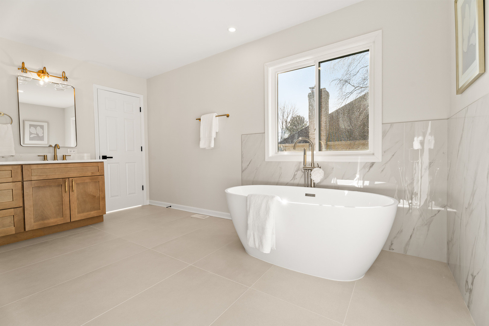 2817 Modaff Road Naperville, IL 60565 - Photo 20 of 43 a white bath tub sitting next to a bathroom sink