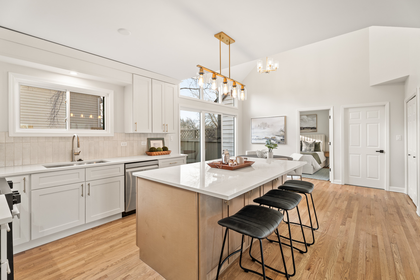 2817 Modaff Road Naperville, IL 60565 - Photo 2 of 43 a open kitchen with a sink a stove and chairs