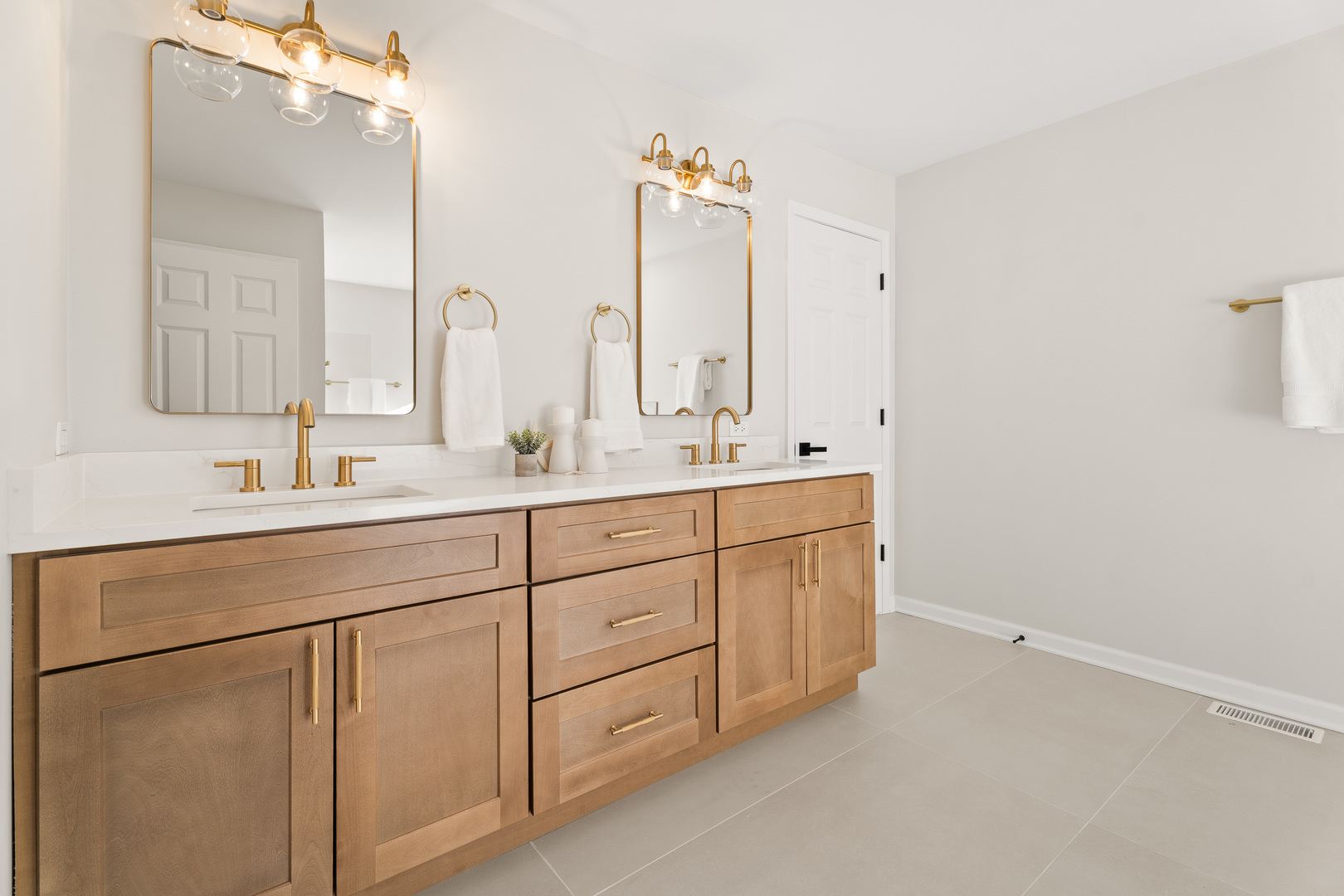 2817 Modaff Road Naperville, IL 60565 - Photo 21 of 43 a bathroom with a double vanity sink and mirror