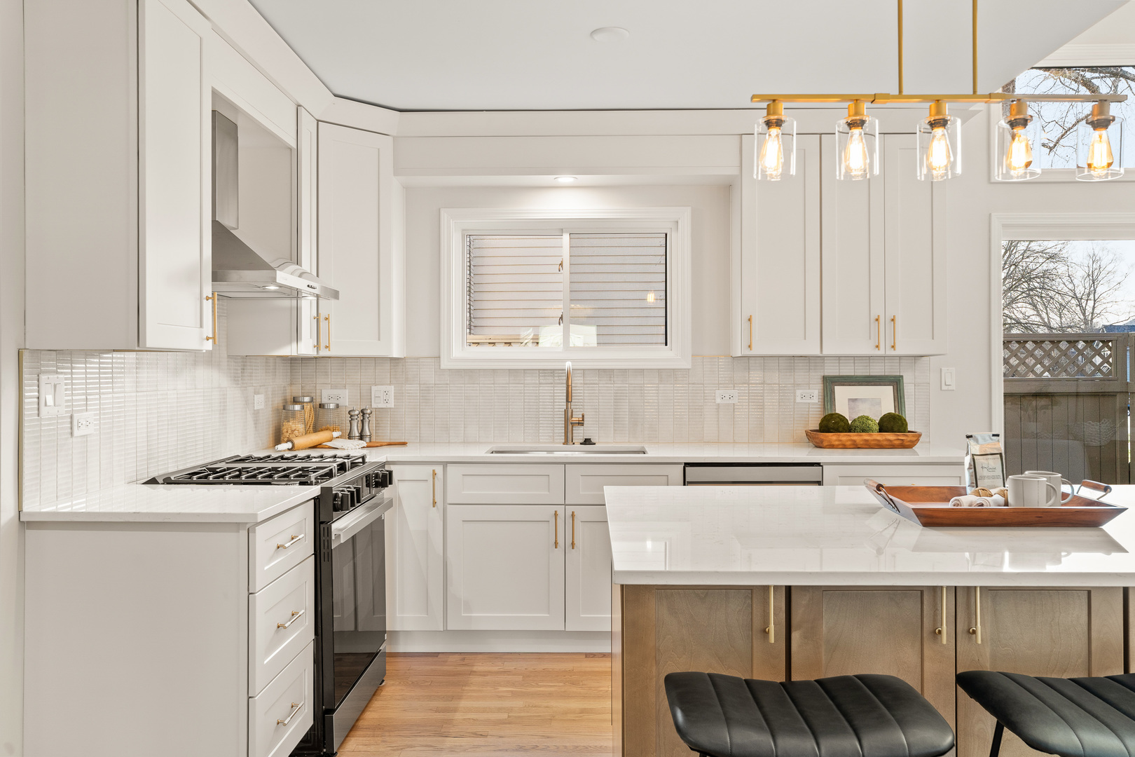2817 Modaff Road Naperville, IL 60565 - Photo 3 of 43 a kitchen with stainless steel appliances granite countertop a sink stove and white cabinets with wooden floor