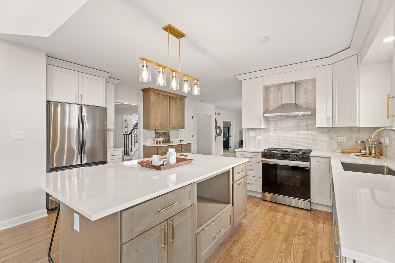 2817 Modaff Road Naperville, IL 60565 - Photo 5 of 43 a kitchen with a sink a stove a refrigerator and white cabinets