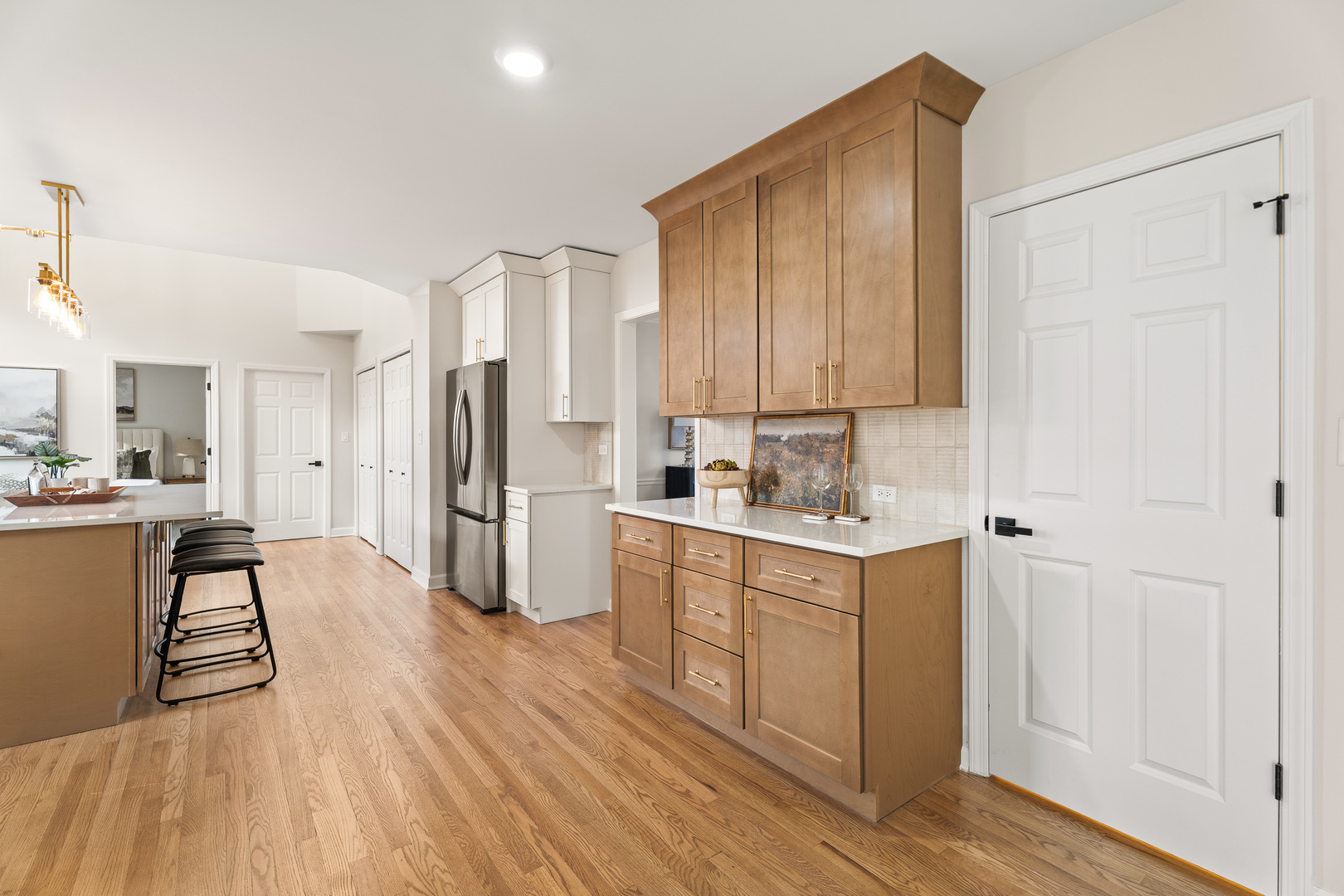 2817 Modaff Road Naperville, IL 60565 - Photo 7 of 43 a kitchen with a refrigerator and white cabinets