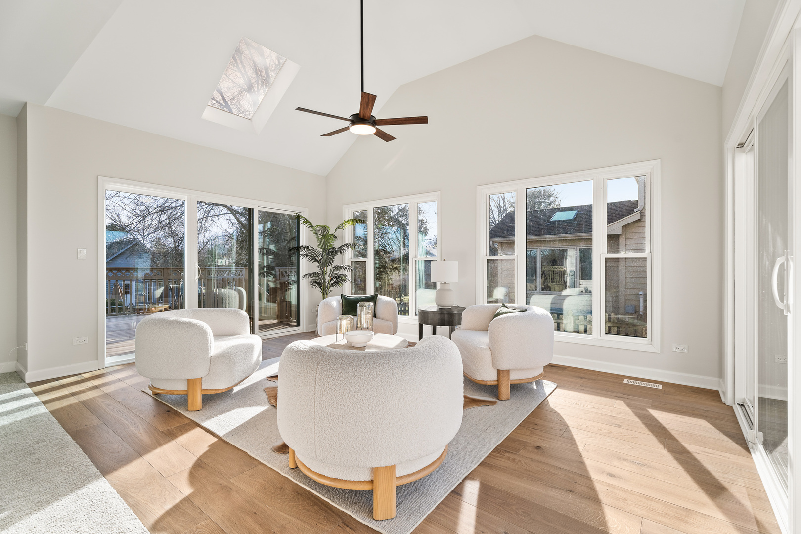 2817 Modaff Road Naperville, IL 60565 - Photo 9 of 43 a living room with couches a coffee table and chandelier
