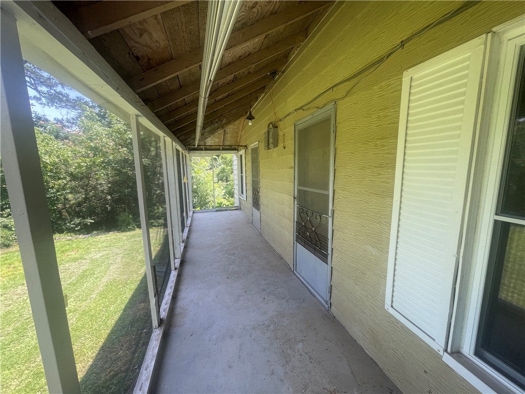 171 River Ridge Road Seneca, SC 29672 - Photo 16 of 22 A classic screened porch extends the living space, offering tranquil views of the verdant yard.