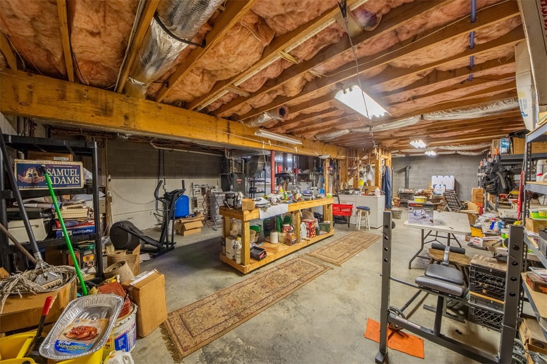 846 Twiggs Ferry Road Hartfield, VA 23071 - Photo 7 of 28 Unfinished below grade area featuring a workshop area