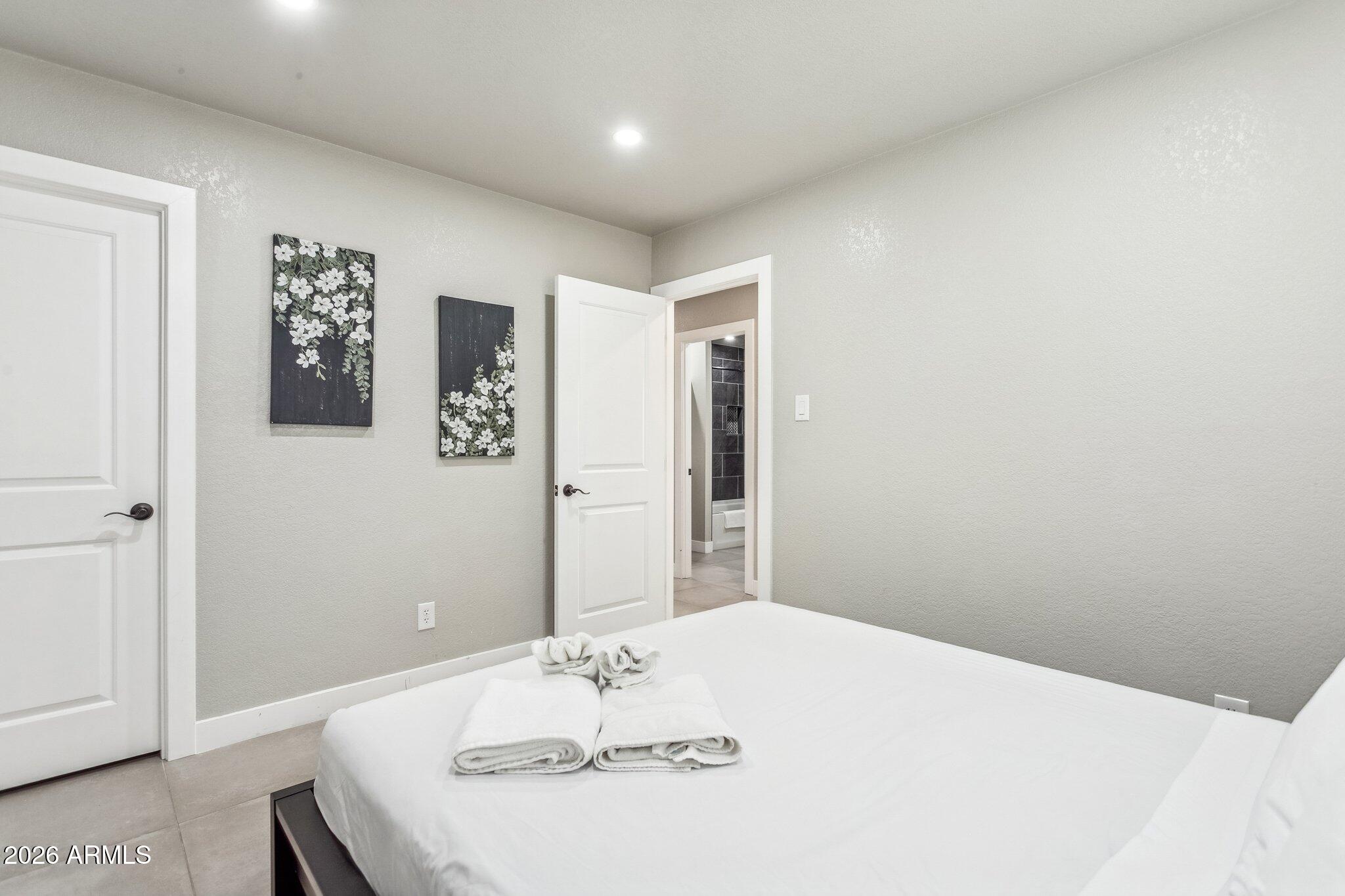 8725 East Osborn Road Scottsdale, AZ 85251 - Photo 20 of 33 a bathroom with a sink and a mirror