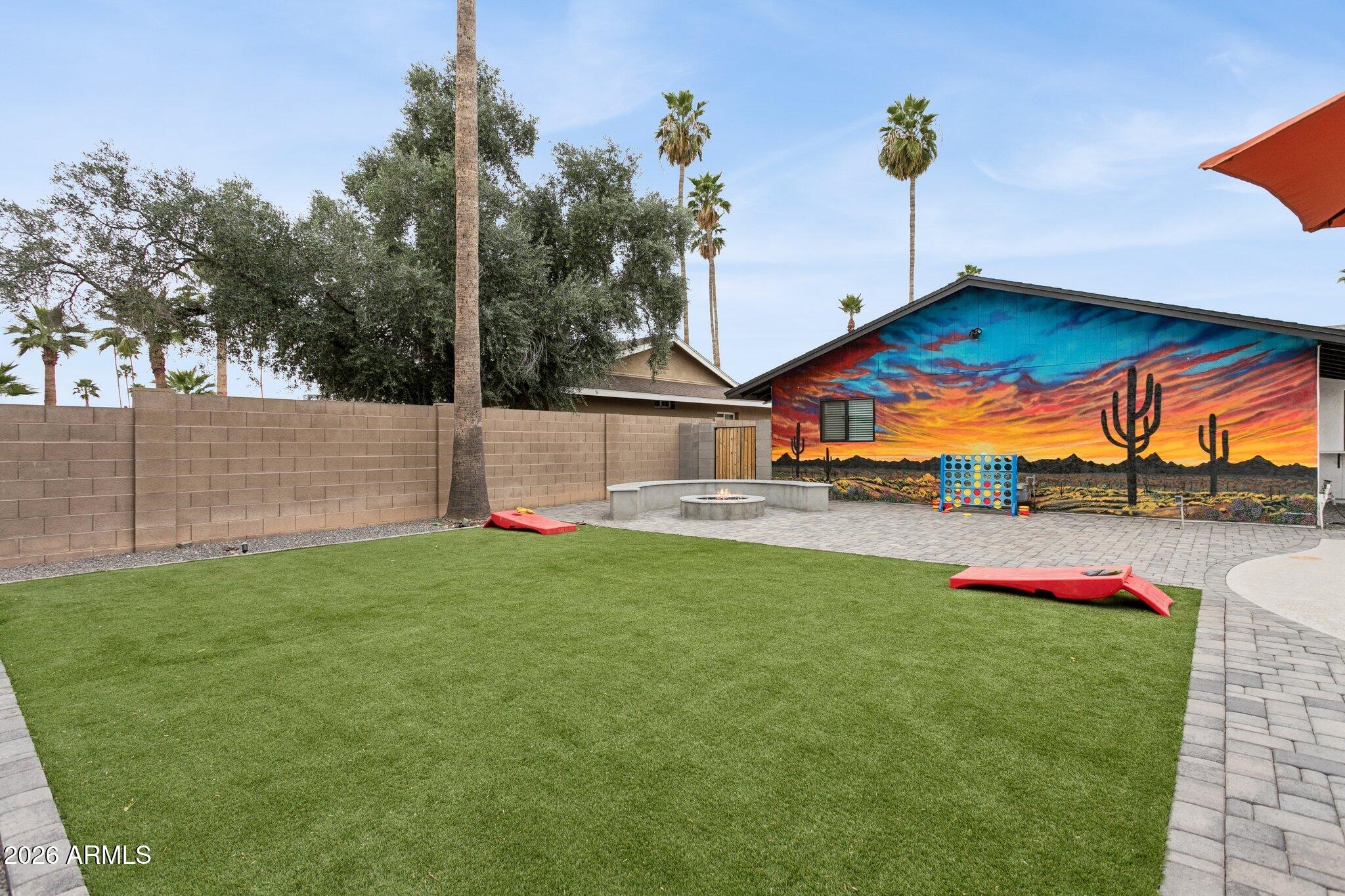 8725 East Osborn Road Scottsdale, AZ 85251 - Photo 25 of 33 a view of a house with a yard