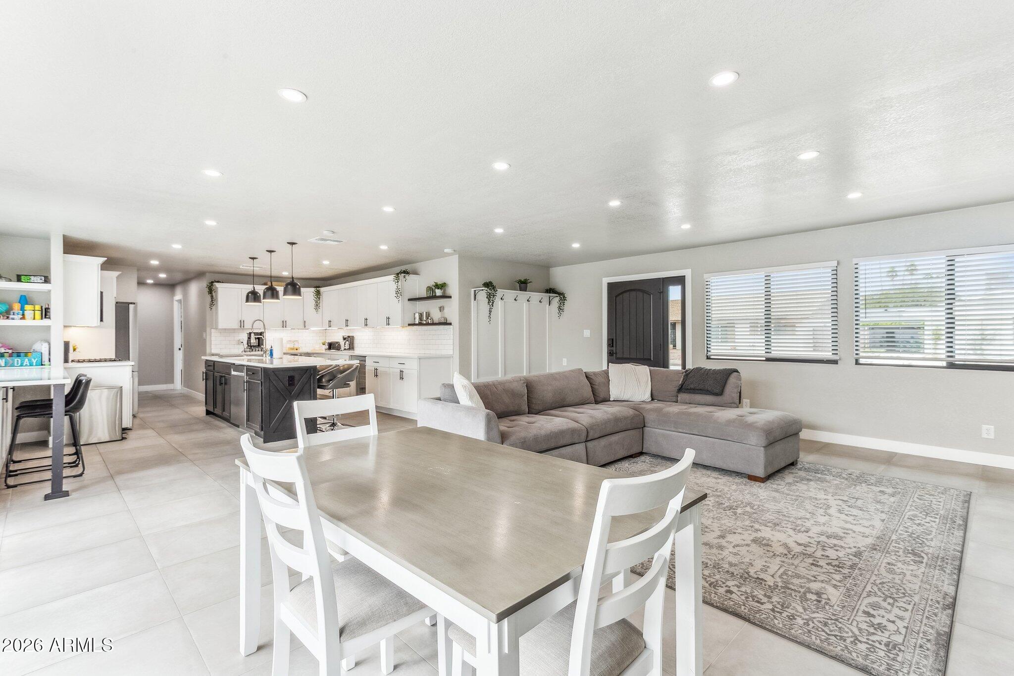 8725 East Osborn Road Scottsdale, AZ 85251 - Photo 33 of 33 a living room with furniture and a large window
