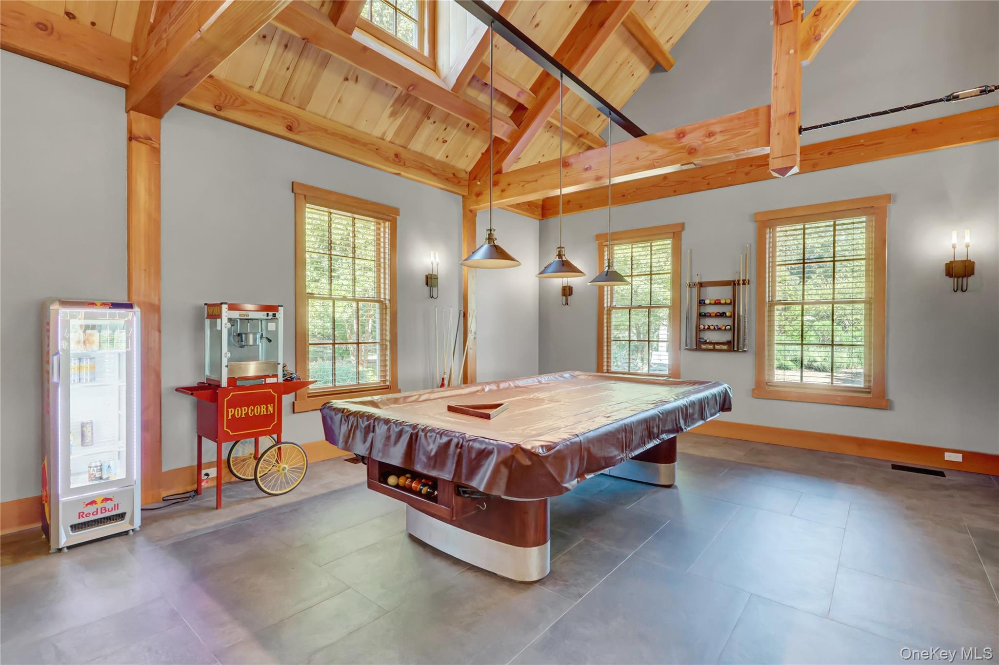 63 Dyke Road Setauket, NY 11733 - Photo 20 of 49 Playroom with billiards, healthy amount of natural light, a wood ceiling with exposed beams, high vaulted ceiling, and a skylight