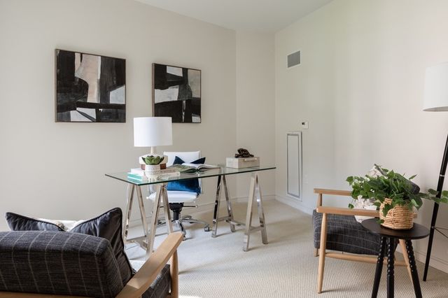 a view of a workspace with furniture