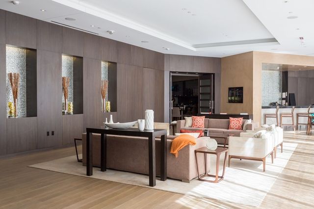 a living room with furniture window and wooden floor