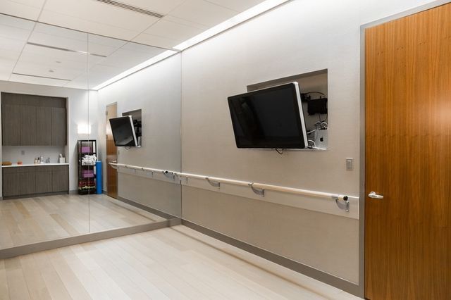 a view of a refrigerator in kitchen and a microwave