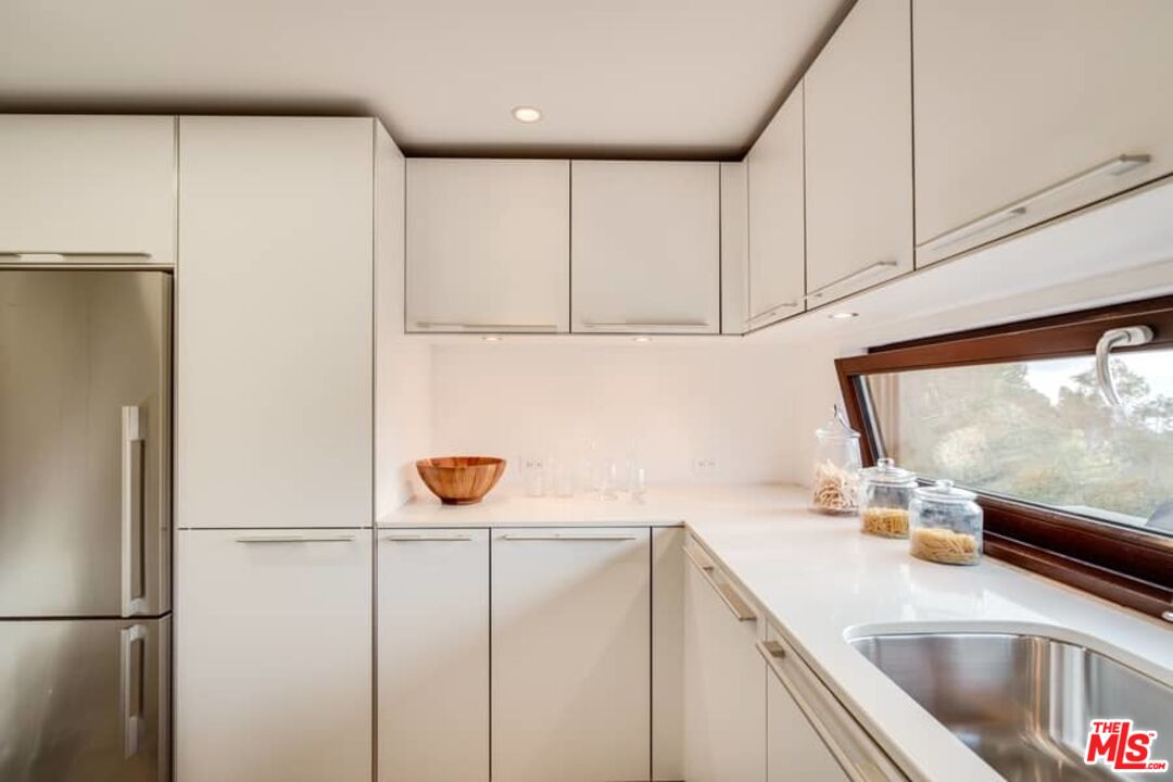 1888 Mango Way Los Angeles, CA 90049 - Photo 23 of 44 a kitchen with stainless steel appliances a refrigerator and a sink