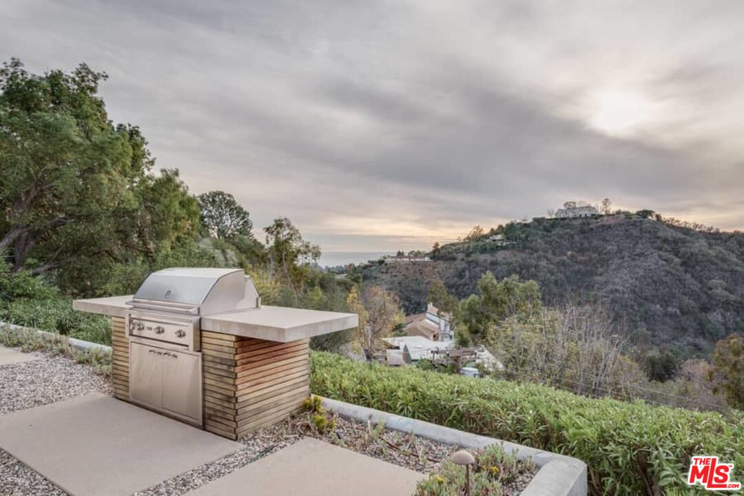 1888 Mango Way Los Angeles, CA 90049 - Photo 25 of 44 a view of a terrace with a garden