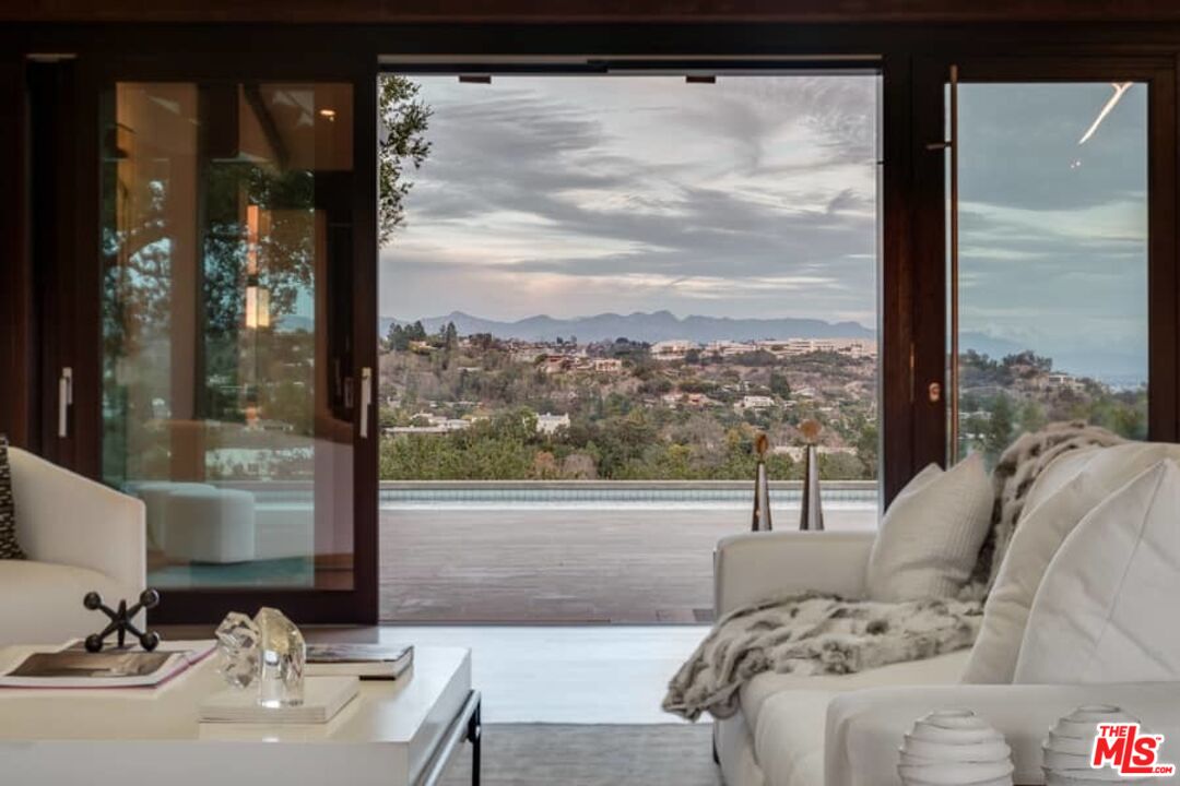 1888 Mango Way Los Angeles, CA 90049 - Photo 3 of 44 a living room with furniture and a large window