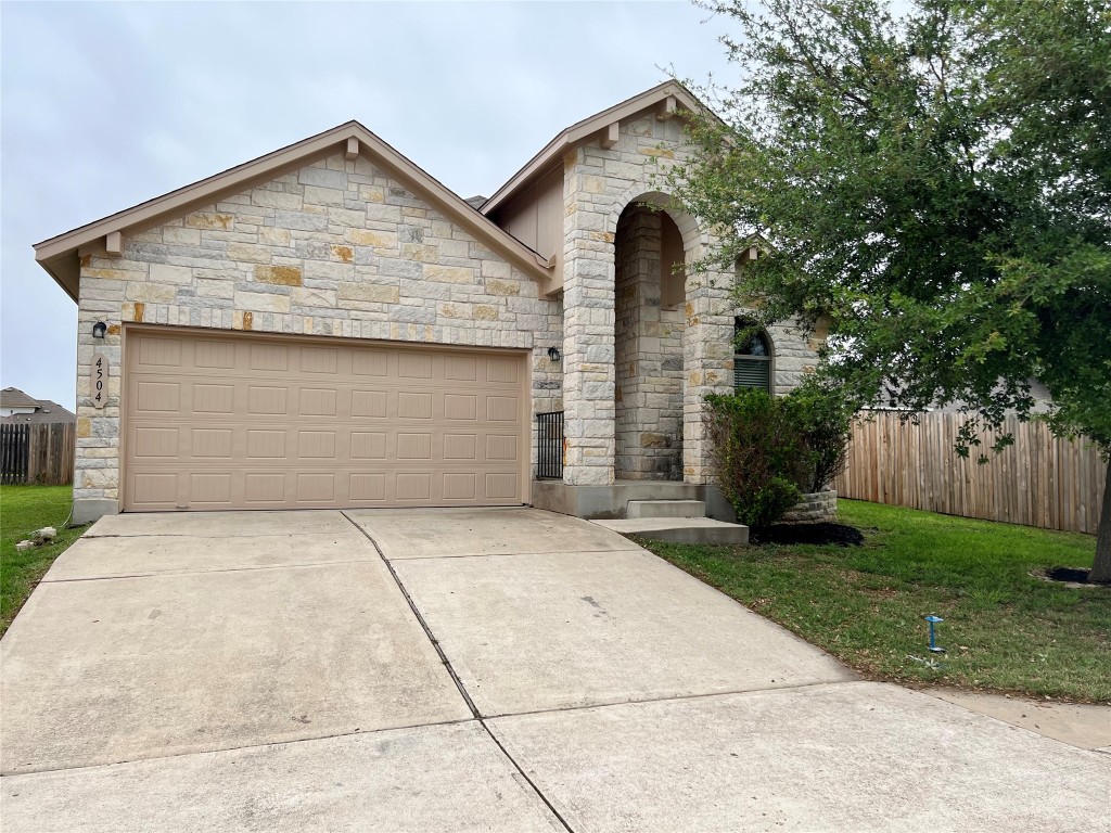 4504 Halliday Avenue Austin, TX 78725 - Photo 1 of 1 front view of house with a yard