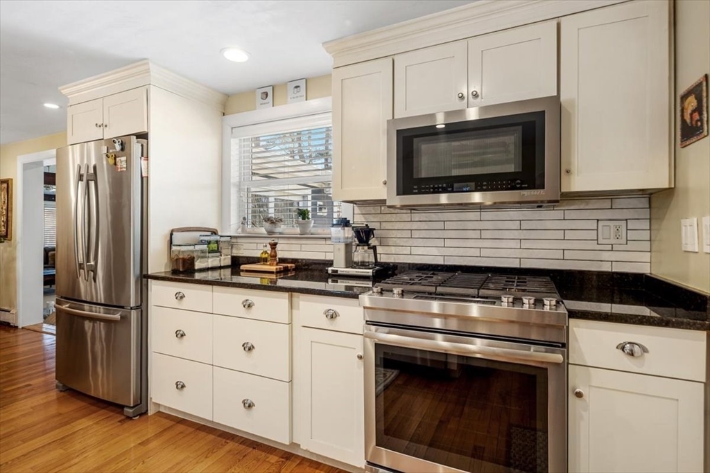 7 Peter Hobart Drive Hingham, MA 02043 - Photo 12 of 38 a kitchen with stainless steel appliances a stove microwave and refrigerator