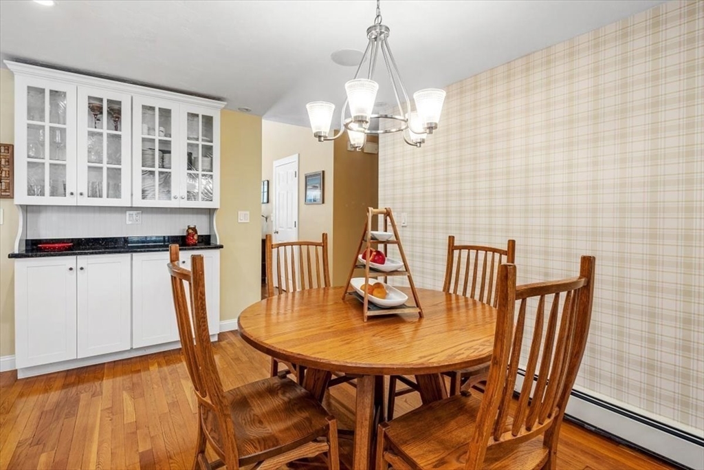 7 Peter Hobart Drive Hingham, MA 02043 - Photo 15 of 38 a view of a dining room with furniture and a chandelier