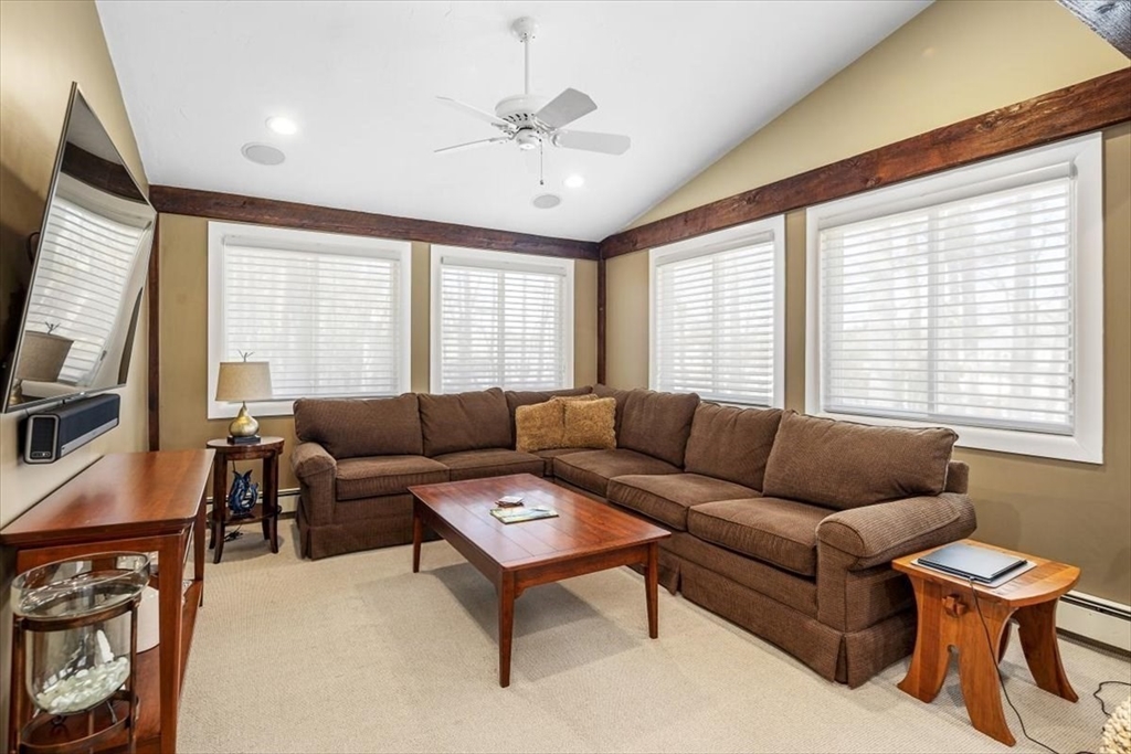 7 Peter Hobart Drive Hingham, MA 02043 - Photo 18 of 38 a living room with furniture a flat screen tv and a window