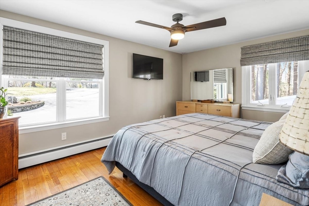 7 Peter Hobart Drive Hingham, MA 02043 - Photo 21 of 38 a bedroom with a large bed and a tv