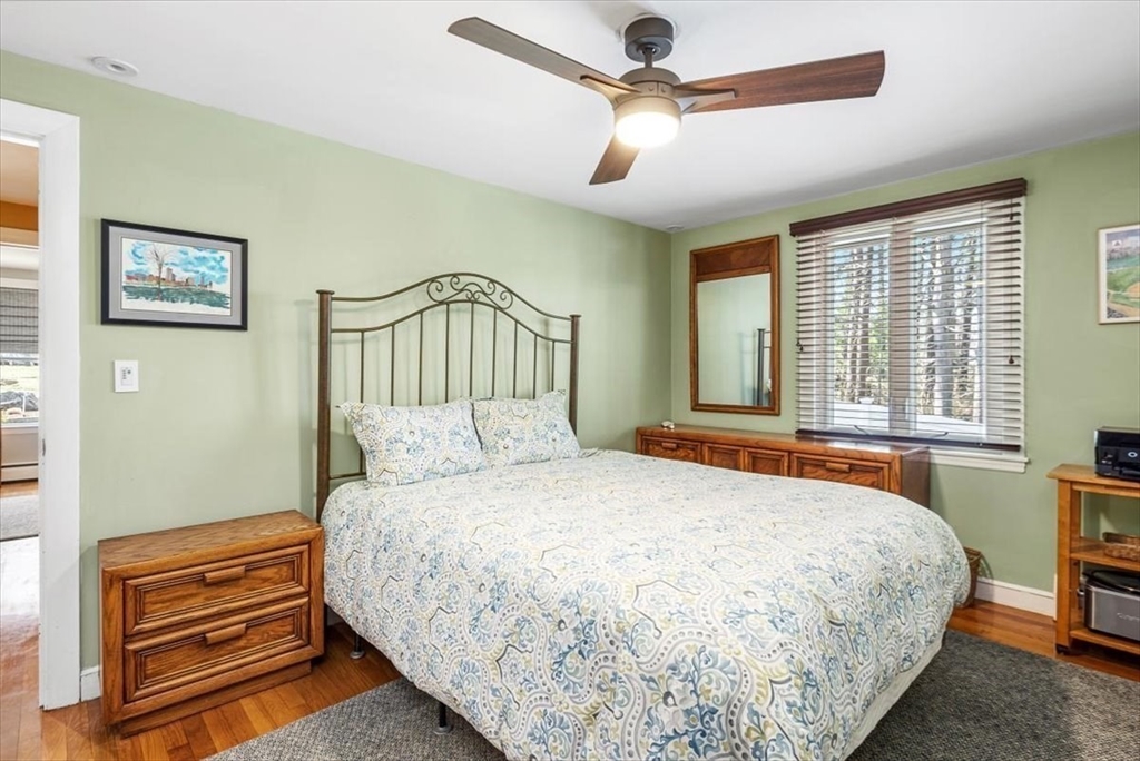 7 Peter Hobart Drive Hingham, MA 02043 - Photo 24 of 38 a bedroom with a bed ceiling fan and a window