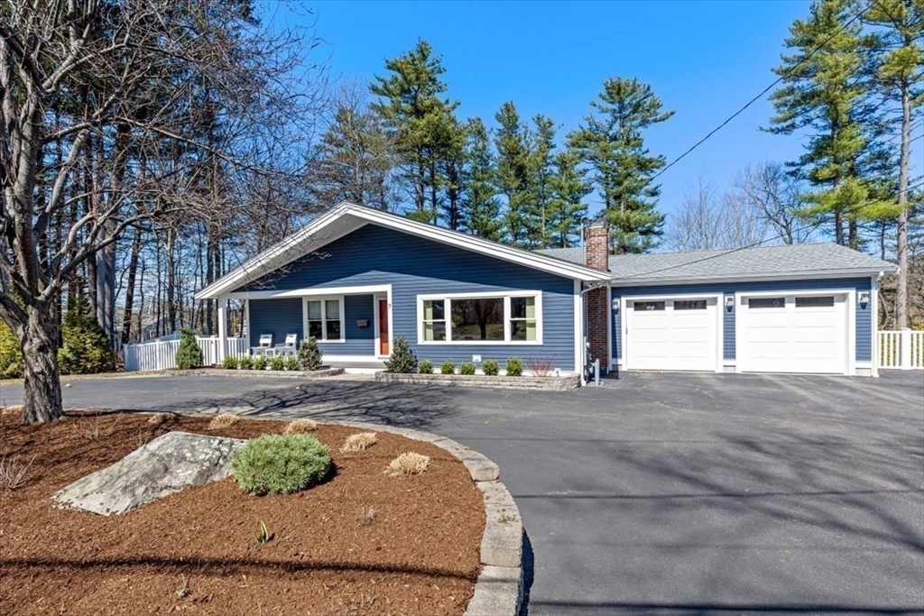 7 Peter Hobart Drive Hingham, MA 02043 - Photo 3 of 38 a front view of a house with a garden