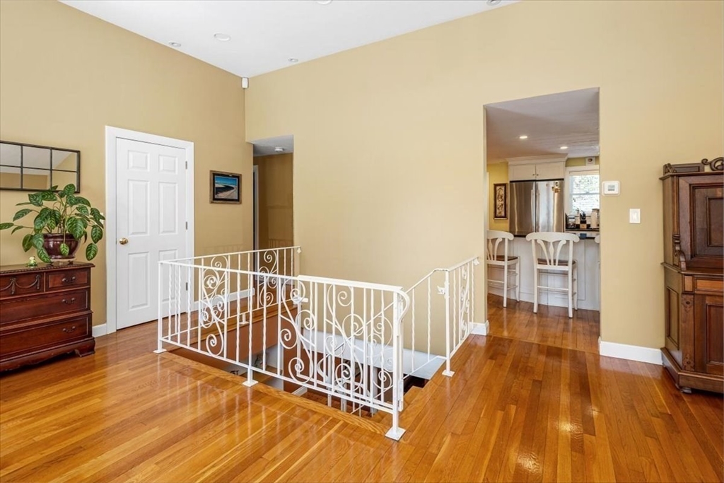 7 Peter Hobart Drive Hingham, MA 02043 - Photo 8 of 38 a view of a bedroom with wooden floor and a potted plant