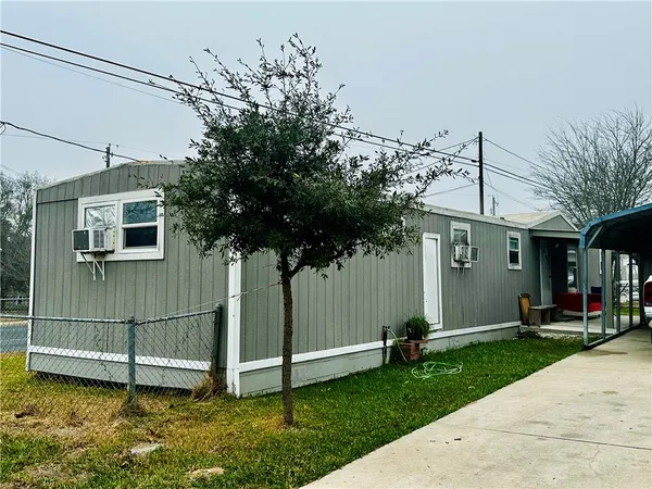 an aerial view of a house with outdoor space