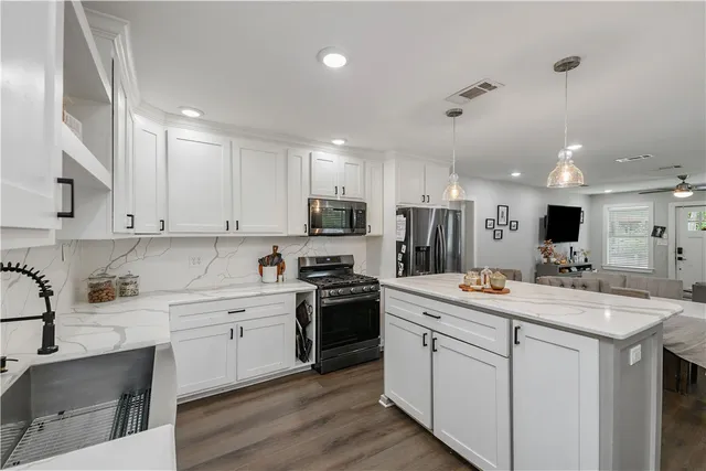 an aerial view of a house with outdoor space