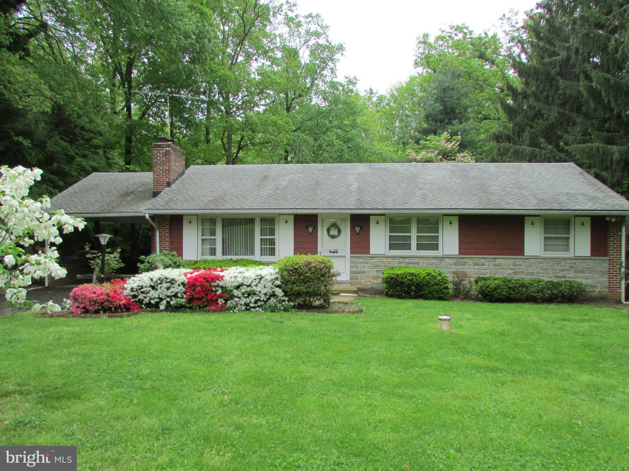 2409 Stoneybrook Road Fallston, MD 21047 - Photo 1 of 16 a front view of house with yard and green space