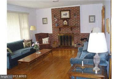 2409 Stoneybrook Road Fallston, MD 21047 - Photo 3 of 16 a living room with furniture and a fireplace
