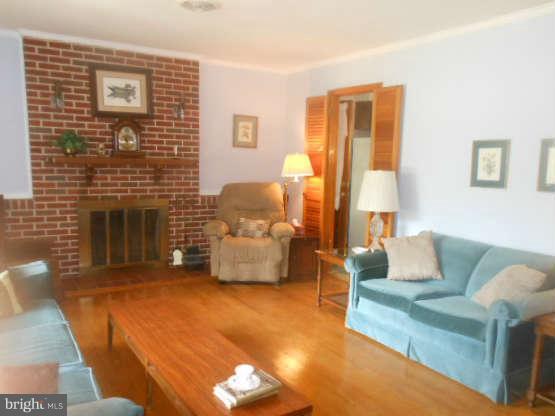 2409 Stoneybrook Road Fallston, MD 21047 - Photo 4 of 16 a living room with furniture and a fireplace