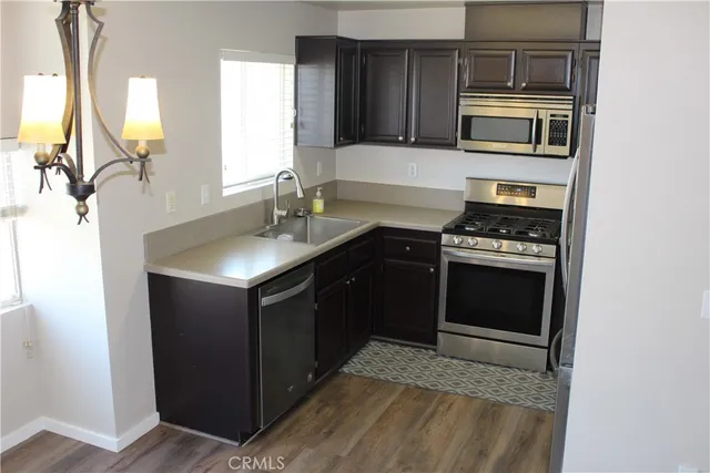 a kitchen with a stove and a microwave