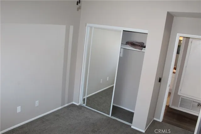 a bathroom with a sink toilet and a mirror