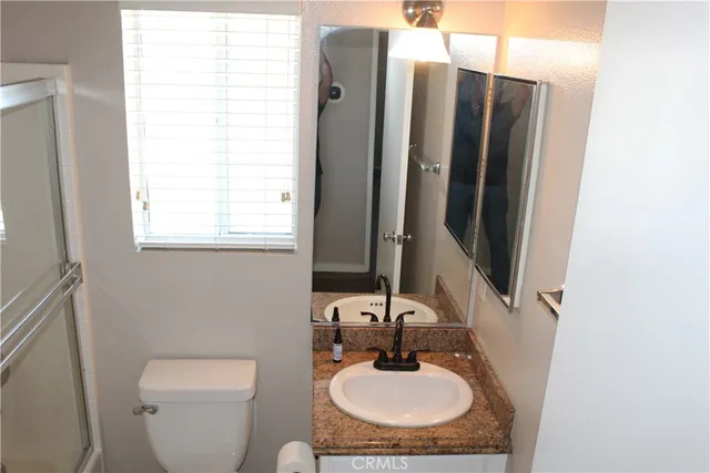 a bathroom with a toilet and a sink