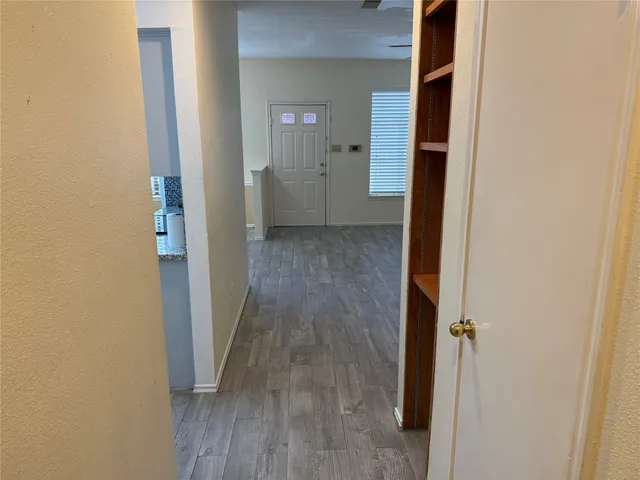 a view of a bathroom from a hallway