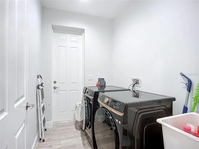 a utility room with dryer and washer