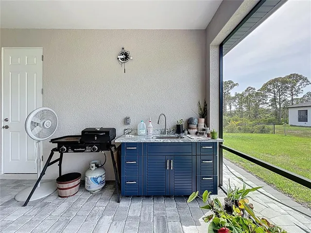 a room with a large window and gym equipment