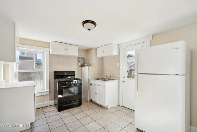 a view of a utility room with closet area