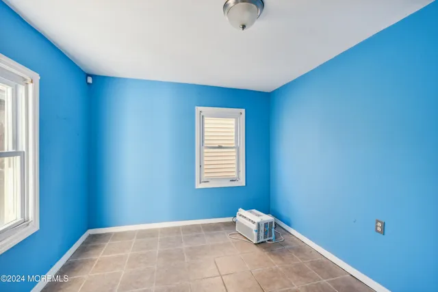 a view of a balcony with two chairs