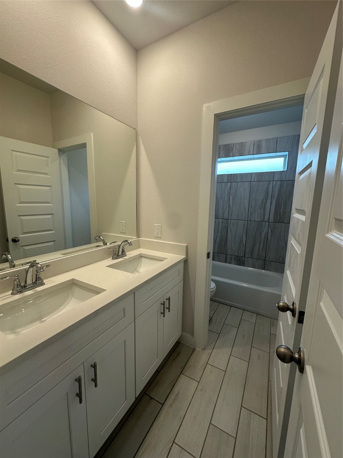 6414 Bolinas Court Rosharon, TX 77583 - Photo 12 of 18 a spacious bathroom with a double vanity sink a mirror and a bathtub