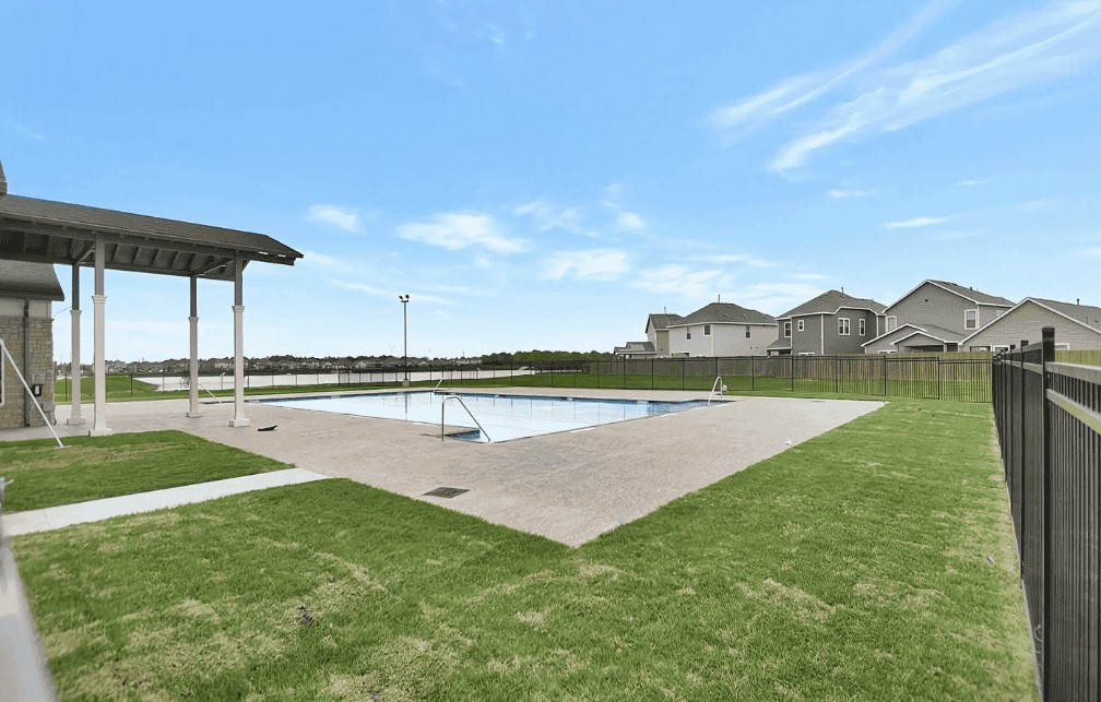 6414 Bolinas Court Rosharon, TX 77583 - Photo 17 of 18 a view of a swimming pool with a yard
