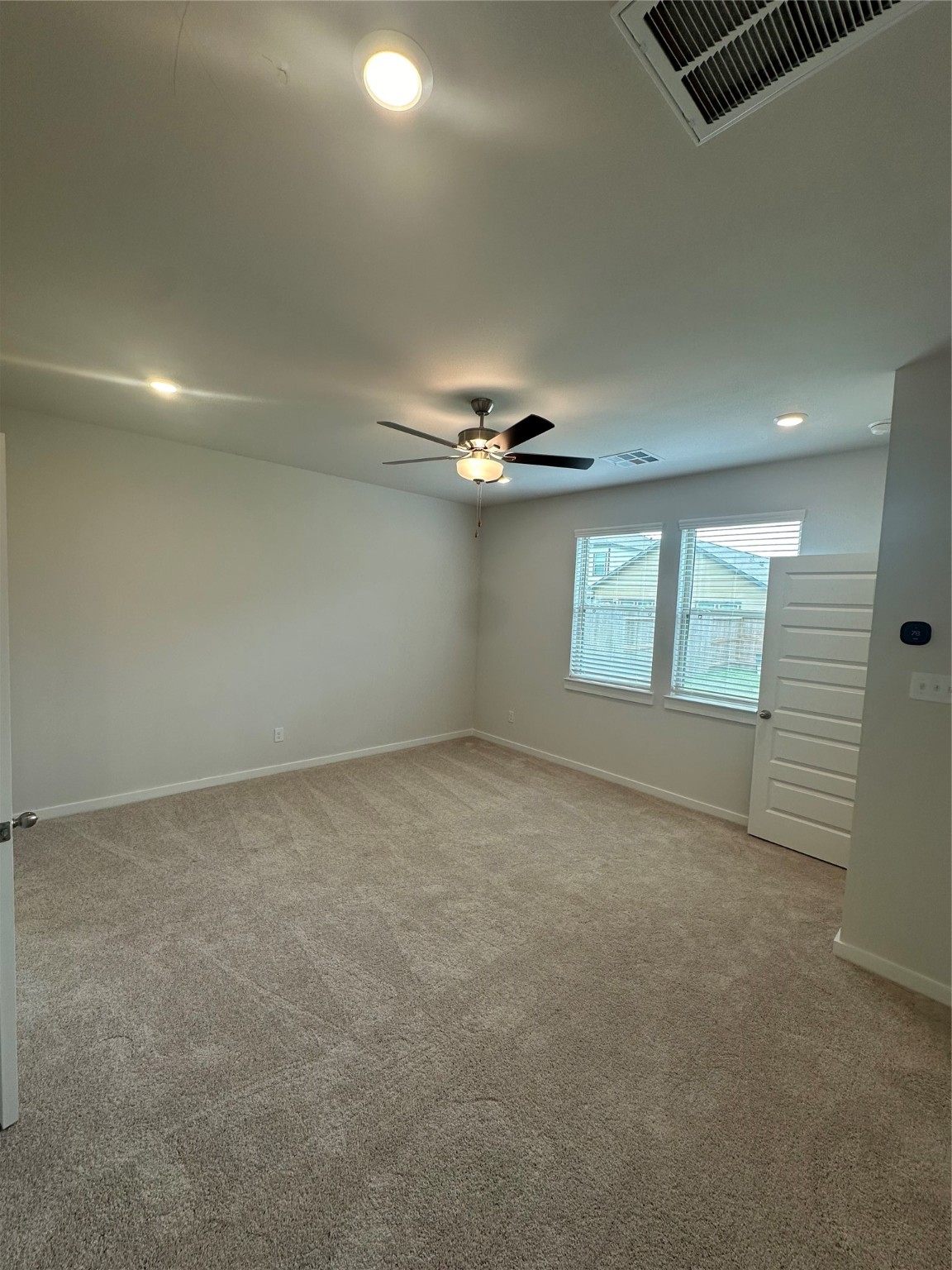 6414 Bolinas Court Rosharon, TX 77583 - Photo 6 of 18 an empty room with windows and ceiling fan
